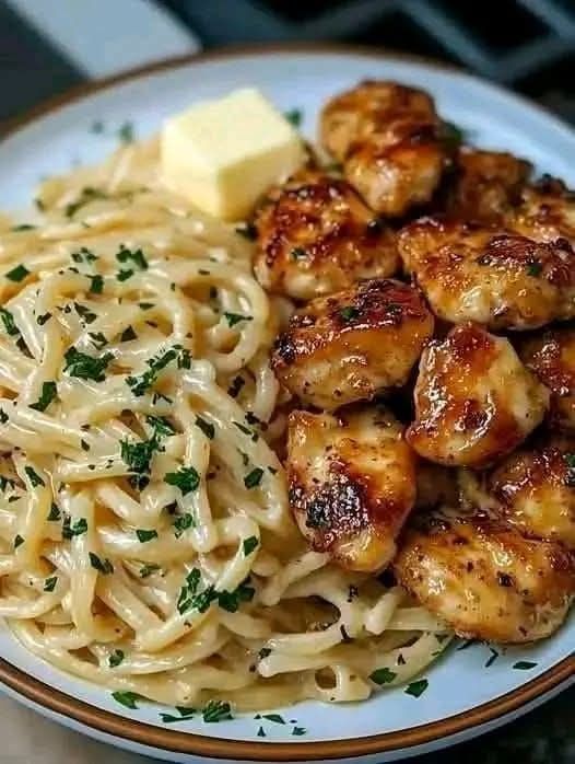 Lemon garlic butter chicken served with creamy parmesan linguine